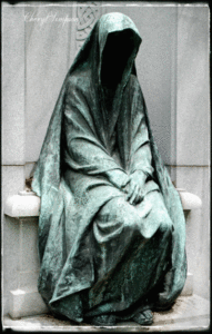 a robed woman sat alone